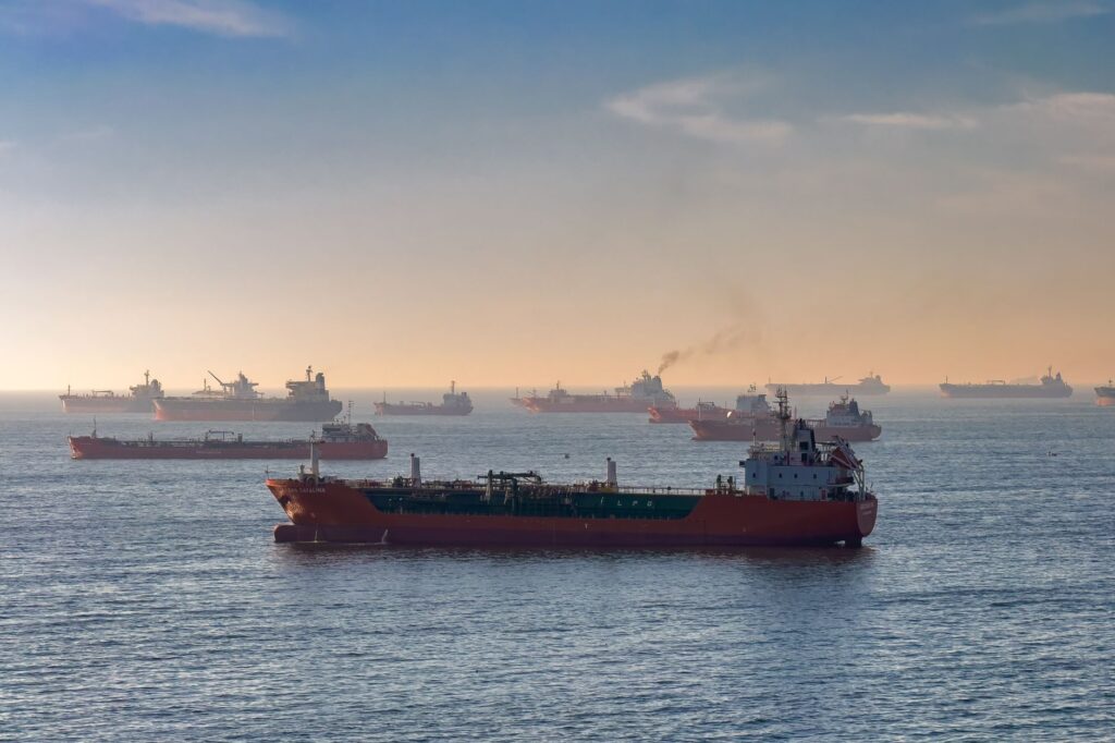 Cargo ships and oil tankers on the Bosporus strait, capturing global trade and maritime logistics at sunset.