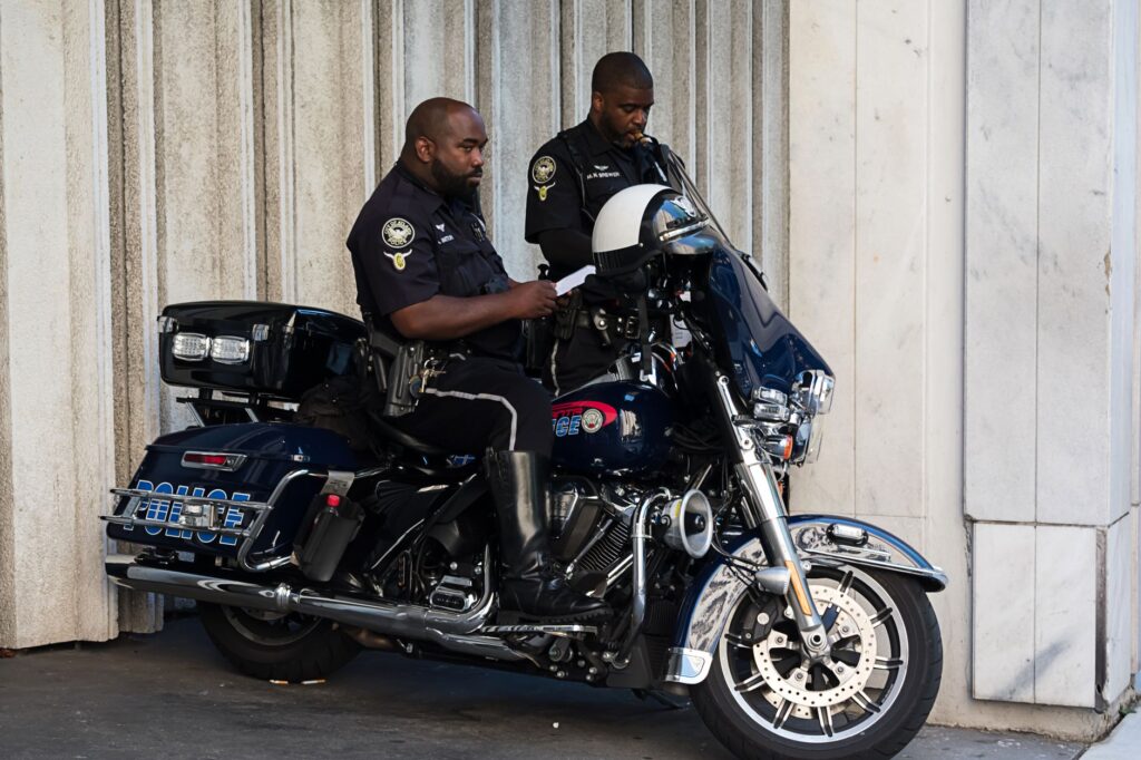 Police officers on a motorbike in Atlanta, showcasing law enforcement in action.