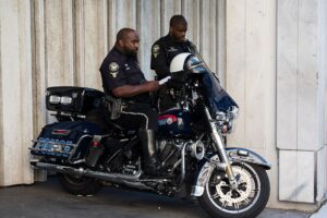 Police officers on a motorbike in Atlanta, showcasing law enforcement in action.